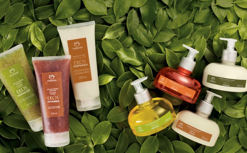 Seven Natura products (body creams) over a background made of green leaves