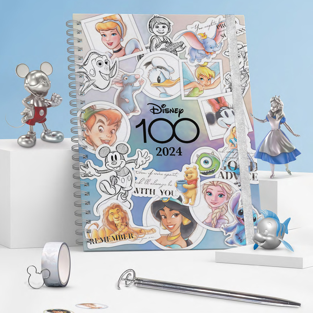 An opalescent agenda with the words "Disney 100 2024", decorated with stickers of different disney characters
