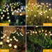 YiQu Package of 8 Solar Christmas Garden Lights for Outdoors 1