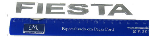 Emblema Tampa Traseira Fiesta Rocam 2002 2003 2004 2005 2006 1